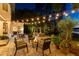 Charming patio area with a cozy fire pit, comfortable seating, and string lights for a relaxing ambiance at 6082 Twin Lakes Dr, Oviedo, FL 32765