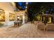 Elegant patio with outdoor dining and lounge areas, perfect for enjoying the serene backyard setting at 6082 Twin Lakes Dr, Oviedo, FL 32765