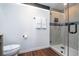 Clean bathroom design with modern tile shower, vanity, and dark accents at 6165 Carrier Dr # 3602, Orlando, FL 32819