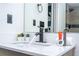 Bathroom sink with running water, black hardware, and included toiletries create a clean, bright space at 6165 Carrier Dr # 3602, Orlando, FL 32819