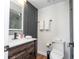 Modern bathroom with wood vanity, a lighted mirror, and a glass-enclosed shower at 6165 Carrier Dr # 3602, Orlando, FL 32819
