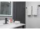 Modern bathroom featuring a wood vanity, lighted mirror, and sleek fixtures at 6165 Carrier Dr # 3602, Orlando, FL 32819