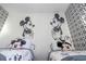 Charming bedroom with twin beds and whimsical Mickey Mouse decor at 6165 Carrier Dr # 3602, Orlando, FL 32819