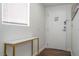Entryway featuring a white door, marble-topped console table, and minimal decor for a clean, modern aesthetic at 6165 Carrier Dr # 3602, Orlando, FL 32819