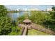 Scenic gazebo overlooking the waterfront, surrounded by lush greenery and a boardwalk at 6165 Carrier Dr # 3602, Orlando, FL 32819