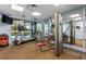 Well-equipped fitness center with treadmills, weight machines, and mirrors at 6165 Carrier Dr # 3602, Orlando, FL 32819