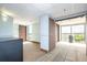 Hallway featuring carpet and tile flooring, natural lighting, and elevator access for convenience at 6165 Carrier Dr # 3602, Orlando, FL 32819