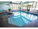 Inviting indoor pool area with lots of seating and a jacuzzi for year-round enjoyment at 6165 Carrier Dr # 3602, Orlando, FL 32819