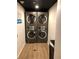 On-site laundry room featuring modern, high-capacity washer and dryer units at 6165 Carrier Dr # 3602, Orlando, FL 32819