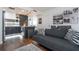 A modern living space featuring stylish furnishings, dark hardwood floors, and an adjacent kitchen area at 6165 Carrier Dr # 3602, Orlando, FL 32819