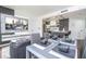 Open concept living space with kitchen and dining area, featuring modern decor at 6165 Carrier Dr # 3602, Orlando, FL 32819