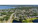 Expansive aerial view of a neighborhood with lush greenery, lakes, and serene residential streets at 6761 Scimitar Ave, Orlando, FL 32812