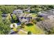 Birds-eye view of two-story house with mature landscaping and a detached garage at 6761 Scimitar Ave, Orlando, FL 32812