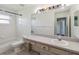 Clean bathroom featuring a large mirror, vanity, toilet, and tiled shower/tub combination at 6761 Scimitar Ave, Orlando, FL 32812