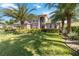 Stunning home exterior with lush landscaping, a manicured lawn, and an elegant design at 6761 Scimitar Ave, Orlando, FL 32812