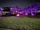 Beautiful two-story home with landscaped yard and colorful nighttime lighting at 6761 Scimitar Ave, Orlando, FL 32812