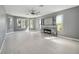 Spacious living room with fireplace and multiple windows that allow natural light to flow into the room at 6761 Scimitar Ave, Orlando, FL 32812