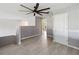 Bright living room with a modern ceiling fan and stylish gray accents throughout the living space at 6761 Scimitar Ave, Orlando, FL 32812