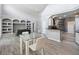 Open-concept space featuring a dining area, living room, and modern kitchen at 6761 Scimitar Ave, Orlando, FL 32812