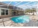 Backyard pool with a screened enclosure, patio area, and well-maintained landscaping around the property at 6761 Scimitar Ave, Orlando, FL 32812