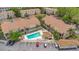 Elevated shot of condos, including a community pool and parking area amidst trees at 692 Seabrook Ct # 103, Altamonte Springs, FL 32714