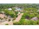 Scenic aerial view of residential buildings and a lake surrounded by abundant greenery at 692 Seabrook Ct # 103, Altamonte Springs, FL 32714