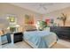 Inviting bedroom featuring a plush bed, neutral carpet, art, a ceiling fan, and bright natural light at 692 Seabrook Ct # 103, Altamonte Springs, FL 32714