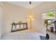 Serene bedroom with neutral decor, a modern console table, and a ceiling fan for added comfort at 692 Seabrook Ct # 103, Altamonte Springs, FL 32714