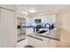 Well-lit kitchen equipped with stainless steel appliances, white cabinets and stylish countertops at 692 Seabrook Ct # 103, Altamonte Springs, FL 32714
