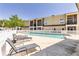 Community pool with lounge chairs and well maintained grounds for resident enjoyment and relaxation at 692 Seabrook Ct # 103, Altamonte Springs, FL 32714