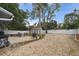 Outdoor space offers privacy fence, patio with dining set, and rock bed at 80 Lombardy Rd, Winter Springs, FL 32708