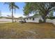 Outdoor space features a patio, mature tree, and partial privacy fence at 80 Lombardy Rd, Winter Springs, FL 32708