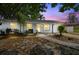 Charming single-story home with a well-manicured front yard and a brick pathway leading to the front door at 80 Lombardy Rd, Winter Springs, FL 32708