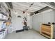Organized garage space with shelving, storage, and convenient access door at 80 Lombardy Rd, Winter Springs, FL 32708
