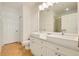 Bathroom featuring dual square vessel sinks and a large mirror at 8180 Boat Hook Loop # 105, Windermere, FL 34786