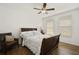 Bright bedroom with hardwood floors, a ceiling fan, and large windows allowing natural light at 8180 Boat Hook Loop # 105, Windermere, FL 34786