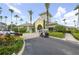 Clubhouse exterior with lush tropical landscaping offering a central hub for community gatherings and events at 8180 Boat Hook Loop # 105, Windermere, FL 34786