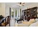 Bright living room with tile floors, stylish curtains and large glass sliding doors at 8180 Boat Hook Loop # 105, Windermere, FL 34786
