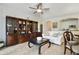 Cozy living room featuring a built-in bookcase, tile flooring, and a neutral color palette at 8180 Boat Hook Loop # 105, Windermere, FL 34786