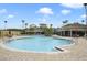 Resort-style pool with surrounding lounge area, perfect for relaxation and recreation under the sun at 8180 Boat Hook Loop # 105, Windermere, FL 34786