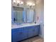 This bathroom features a double vanity with a marble countertop at 8225 Corkfield Ave, Orlando, FL 32832