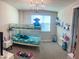 This bedroom includes a bunk bed and a window with a view at 8225 Corkfield Ave, Orlando, FL 32832