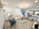 Open-concept living room featuring modern decor, hardwood floors, and plenty of natural light at 8225 Corkfield Ave, Orlando, FL 32832