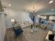 Open-concept living room featuring modern decor, hardwood floors, and plenty of natural light at 8225 Corkfield Ave, Orlando, FL 32832