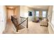 Upstairs loft area with comfortable seating, a television, and lots of natural light at 8225 Corkfield Ave, Orlando, FL 32832