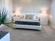 Spacious main bedroom with neutral décor, carpet flooring, and bedside tables with lamps at 8225 Corkfield Ave, Orlando, FL 32832