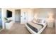 Spacious main bedroom with neutral décor, carpet flooring, and bedside tables with lamps at 8225 Corkfield Ave, Orlando, FL 32832