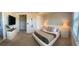 This spacious primary bedroom features a king bed, television, and ensuite bath at 8225 Corkfield Ave, Orlando, FL 32832