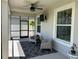 Inviting covered patio featuring comfortable seating, offering a relaxing outdoor living space at 8225 Corkfield Ave, Orlando, FL 32832