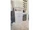 The walk-in closet features a built-in mini-fridge and coffee bar area at 8225 Corkfield Ave, Orlando, FL 32832